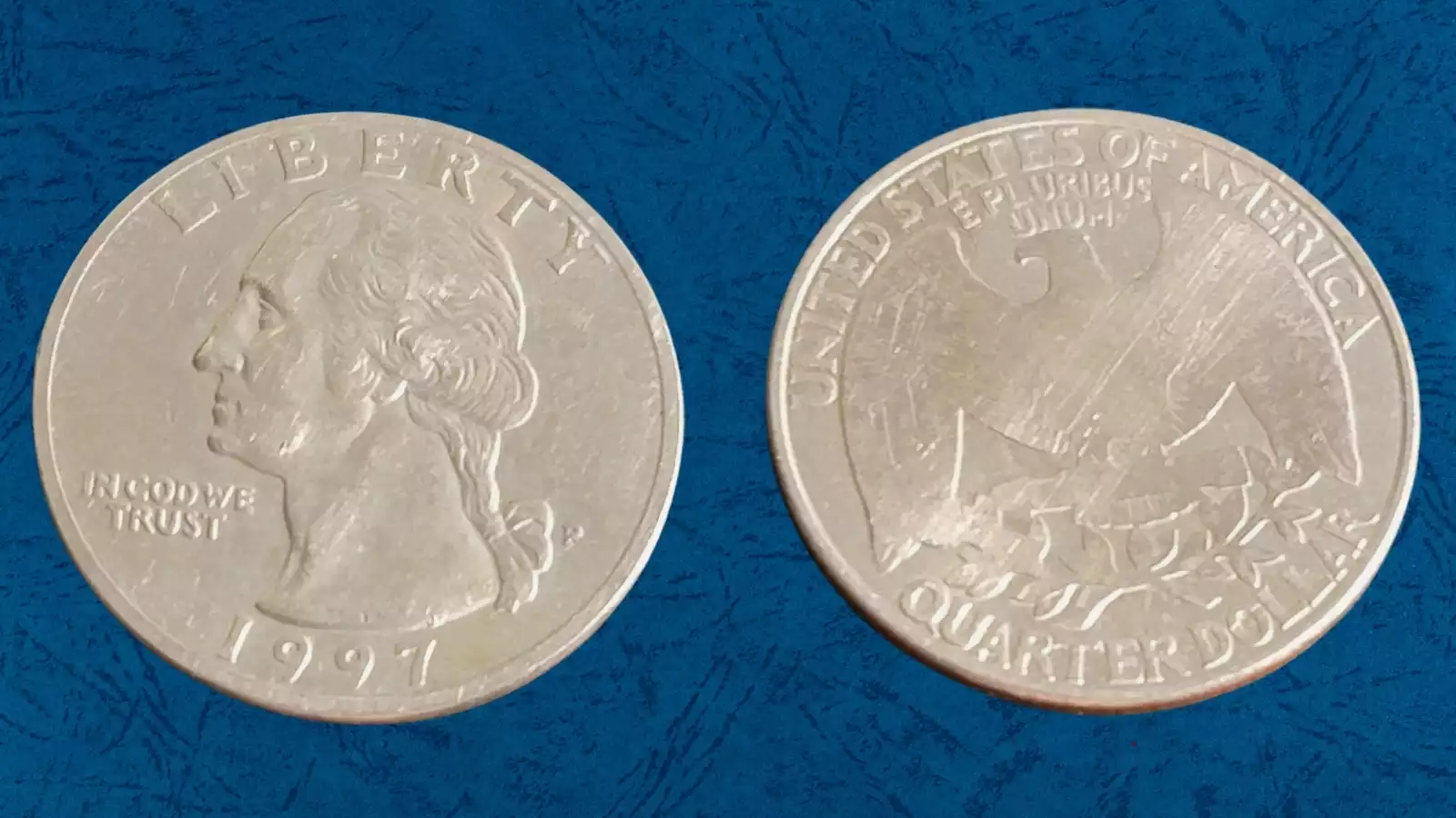1997 quarter wrong planchet error coin showing size or color discrepancy compared to a normal Washington quarter