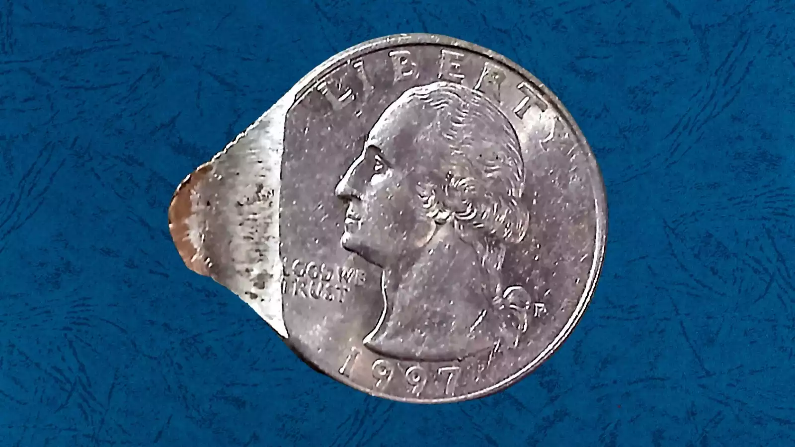 1997 quarter die crack error showing a raised line running across the Washington portrait or eagle reverse